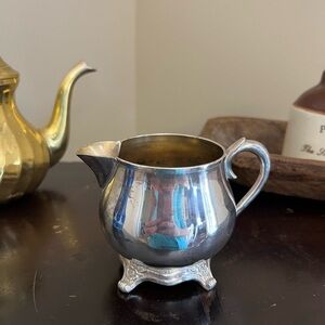 Silver Creamer with Ornate Base